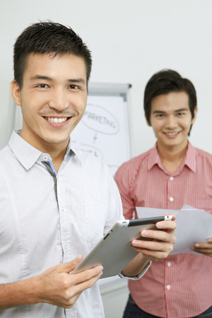 Businessmen smiling at the camera の写真素材