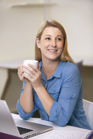 Businesswoman having a drinkの写真素材