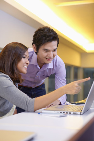 Business people working together on laptopの写真素材