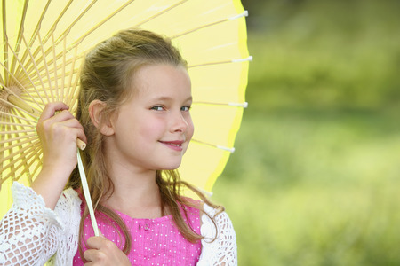 Girl holding an umbrellaの写真素材