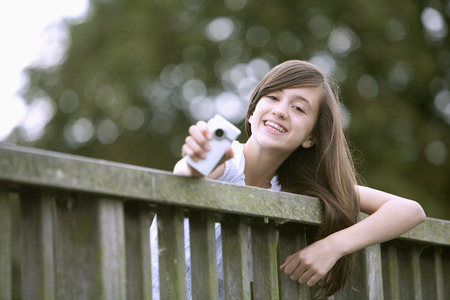Girl showing mobile phoneの写真素材