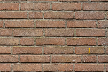 Close up of a red and brown brick wall