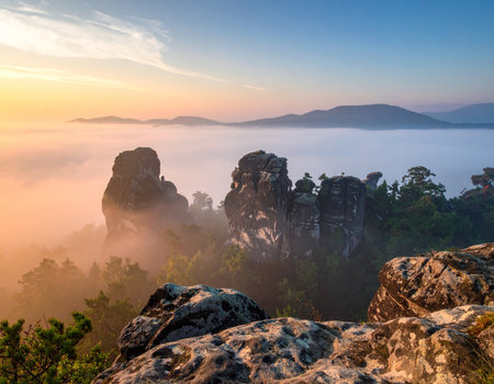 Misty morning view of sandstone mountains in Adrspach-Teplice Rocks, Czech Republicの素材
