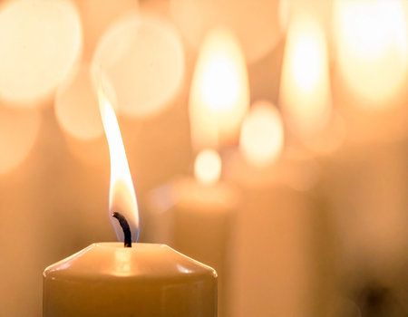 Burning candle with bokeh background, shallow depth of fieldの素材