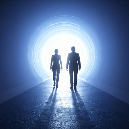 Silhouette of a man and a woman standing in a tunnelの素材