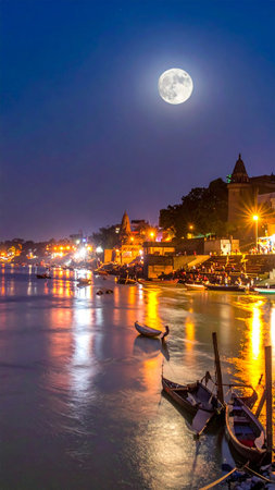 Venice at night with full moon and boats in the foreground.の素材