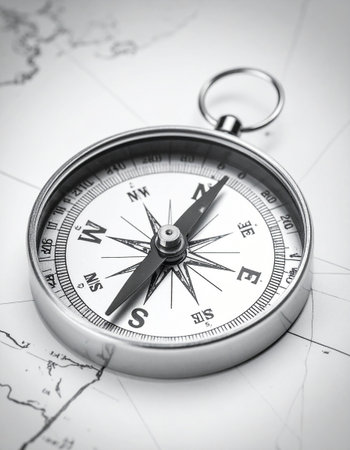 Compass on the map, closeup of photo with shallow depth of fieldの素材