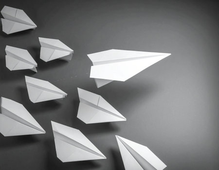 Paper plane on grey background. Concept of leadership and success. Copy space.の素材