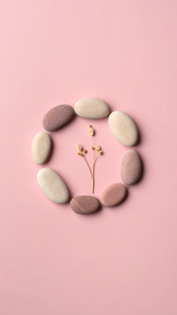 Spa stones and flower on pink background. Flat lay, top viewの素材