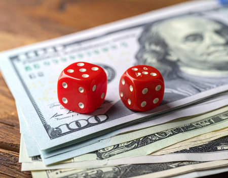 Dice and money on a wooden background. Close-up.の素材