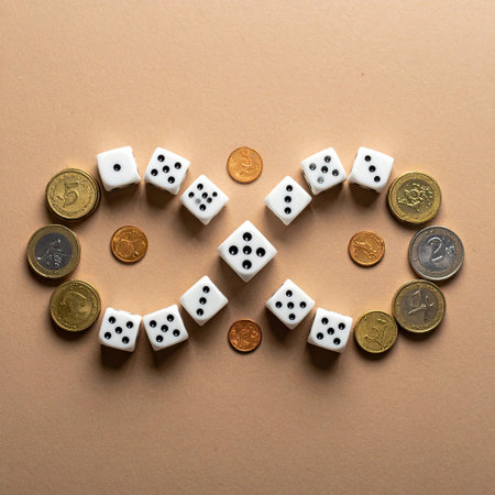Dice and coins on a brown background. The concept of luck and gambling.の素材