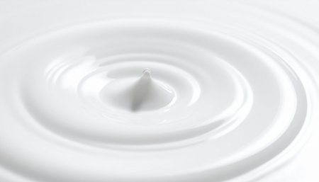 close up of a drop of milk on white background with copy spaceの素材