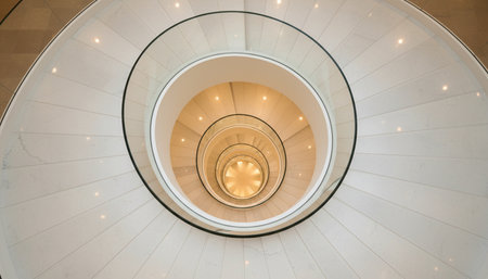 Spiral staircase in a modern building. View from above.の素材