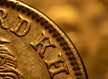 Close up of old russian ruble coin on golden background.の素材