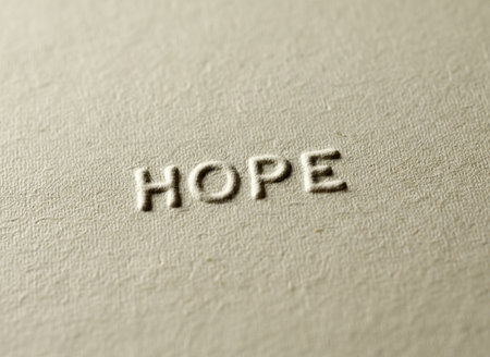 Hope word printed on a piece of paper with a shallow depth of fieldの素材