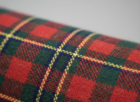 Scottish tartan fabric closeup, macro shot, selective focusの素材