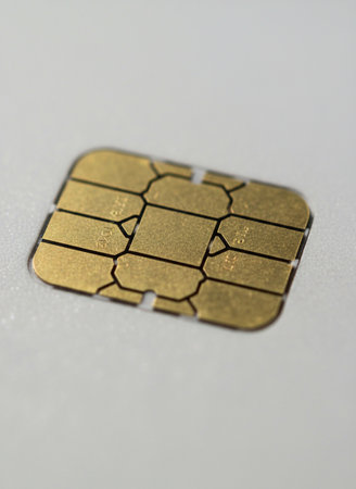Close-up of a gold micro sim card on a white backgroundの素材