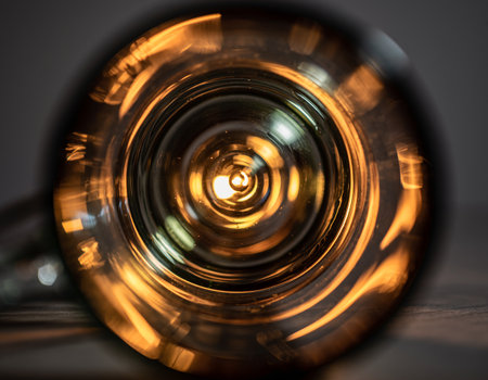 Close-up of a glass of wine on a dark background.の素材