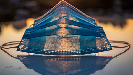 Protective mask on the table. Coronavirus concept.の素材