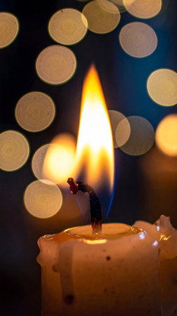 candle flame with bokeh background, christmas and new year conceptの素材