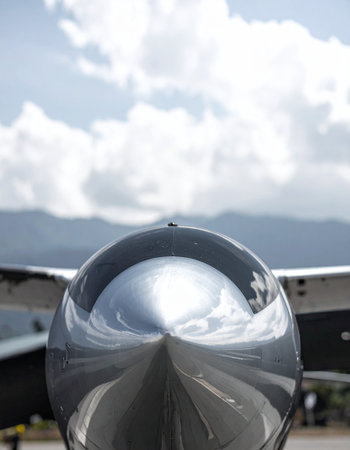 Close up of a propeller of a fighter jet with cloudy skyの素材