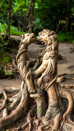 Statue of lion and lioness on the tree in the parkの素材
