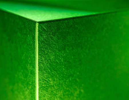 Green gift box close up. Abstract green background and texture for design.の素材