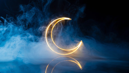 Lighted crescent moon on a black background with smoke and fogの素材