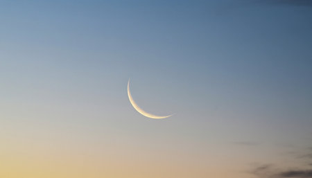 Crescent moon in the blue sky at sunset, natural background.の素材