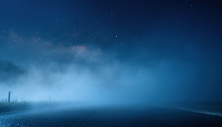 Foggy road at night with starry sky and stars.の素材