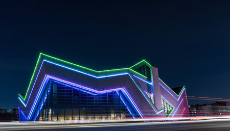 Futuristic building in the city at night with neon lights.の素材