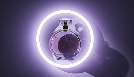 Perfume bottle in neon light on purple background. 3D renderingの素材