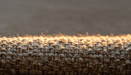 Closeup detail of brown knitted fabric texture background. Soft focus.の素材
