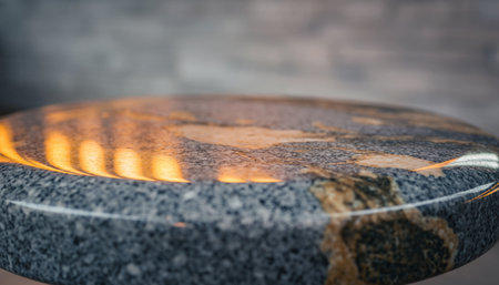 Close up of marble countertop with spot light on wooden background.の素材