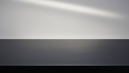 Empty black wood table top on white wall background. For product displayの素材