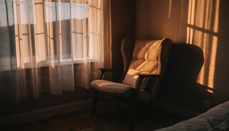Interior of a hotel room with a vintage armchair and a windowの素材