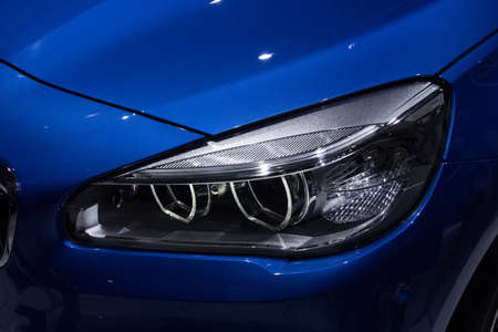 Illustration and close-up on a car headlightの写真素材