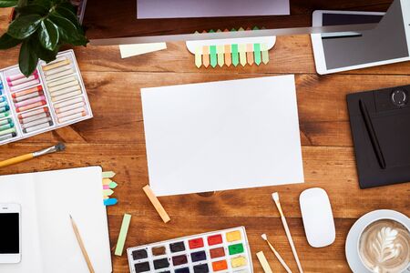 Modern creative design workplace concept with computer monitor and paints crayons empty mock up...