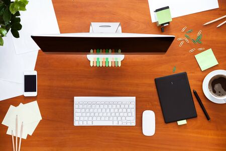 Business work desk with computer monitor keyboard mouse and supplies stationary, office table...