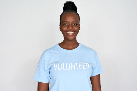 Happy african woman activist wear volunteer tshirt isolated on grey background.の写真素材