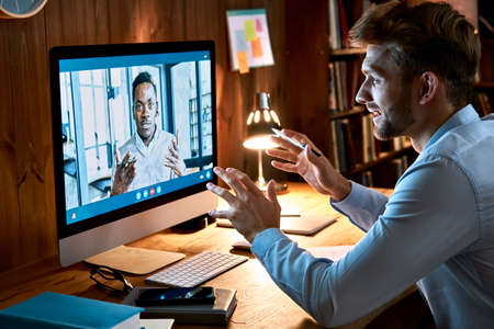 Diverse business men talking on video conference call virtual meeting.