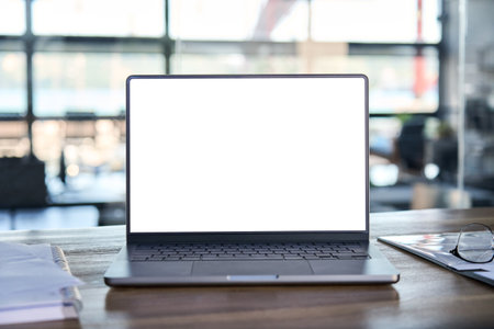 Laptop computer mock up template screen on office workplace desk.の写真素材