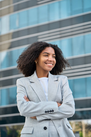 Happy young African American business woman standing in city feeling proud.の写真素材