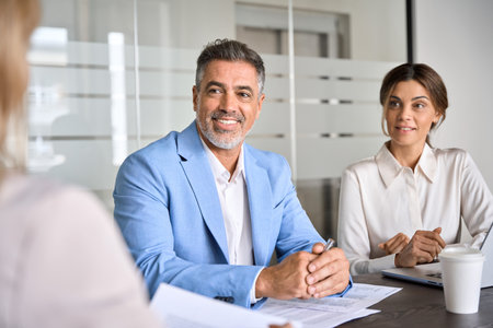 Happy busy business people executive team working together at group meeting.の写真素材