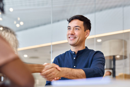 Business handshake of male bank manager and female client at office meeting.の写真素材