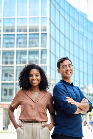 Portrait of young happy professional team of two diverse business man and woman.の写真素材