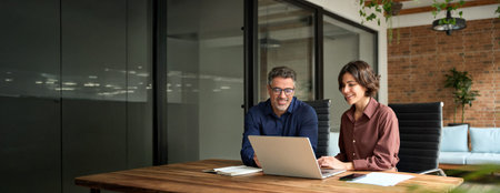 Happy busy executive people working together using laptop computer in office.