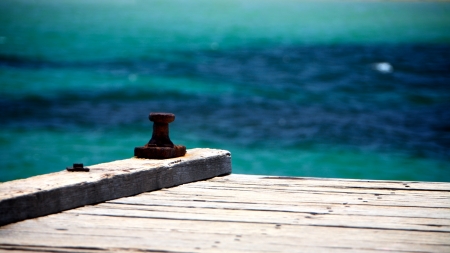 Old wooden peir at the beachの写真素材
