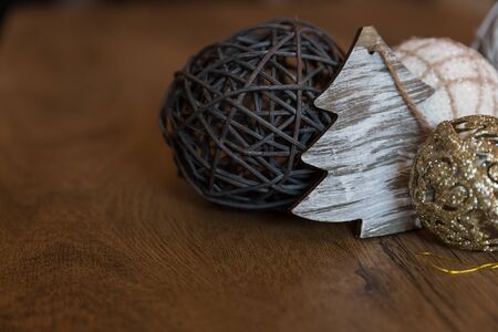 Hand made Christmas decorations on wooden background with rustic feel and holiday vibe to it. Space for text.の写真素材