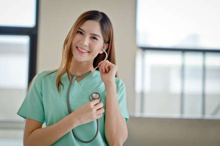 Happy doctor smiling at cameraの写真素材